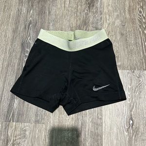 Extra small black nike spandex with a yellow waistband